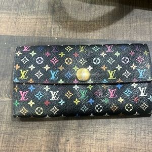 LV Louis Vuitton wallet.  Clean inside with little wear in the coin pocket.